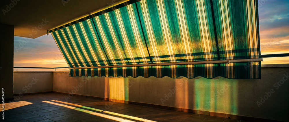 Fototapeta premium Balcony awning casting colorful shadows at sunset