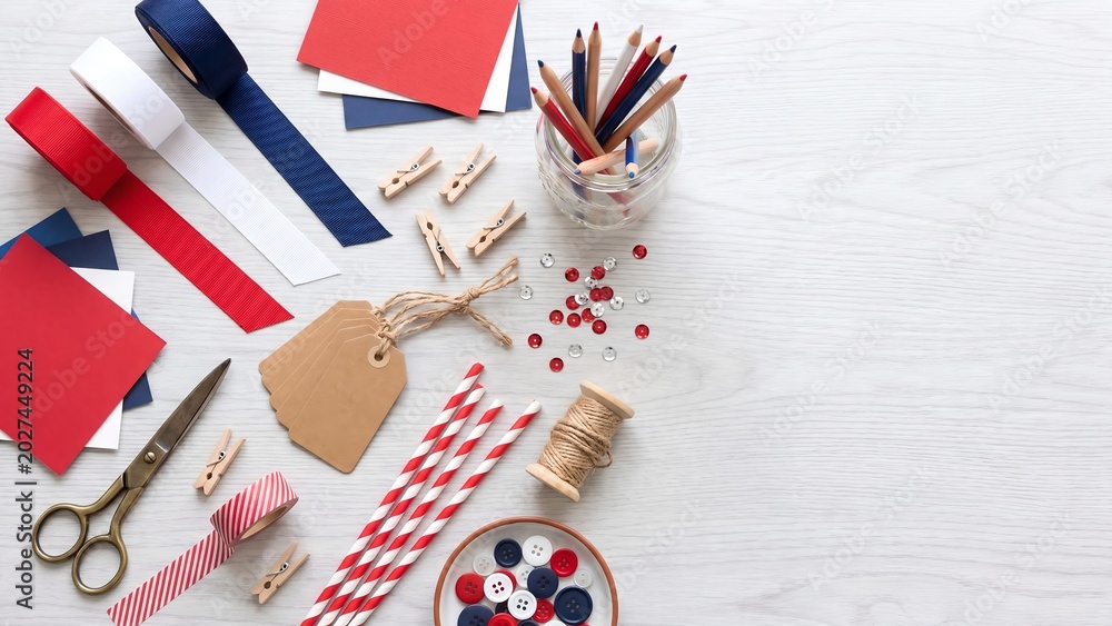 Obraz premium Patriotic Craft Supplies Flatlay with Ribbon Scissors Buttons and Stationery for Independence Day DIY Holiday Decoration Project Ideas