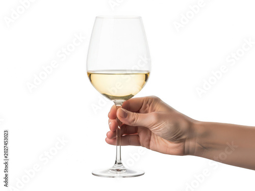 A hand holding a glass of white wine isolated on white background