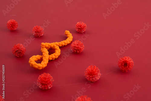 Fotografía Ebola virus model surrounded by replicating coronavirus particles