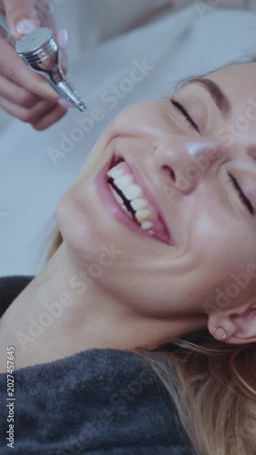 Gentle facial with oxygen therapy, Calm female client is receiving soothing oxygen facial in tranquil spa setting