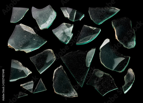 Broken Glass Shards and Splintered Fragments Isolated on Black Background