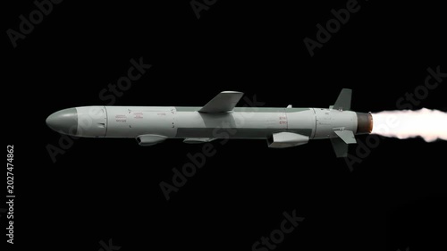 A matte gray cruise missile travels horizontally against a solid black background, featuring crisp technical markings and stabilizing fins. This clean, side-profile element is ideal for defense techno