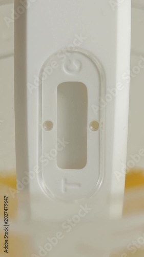 Detailed shot of a medical test showing a positive indication