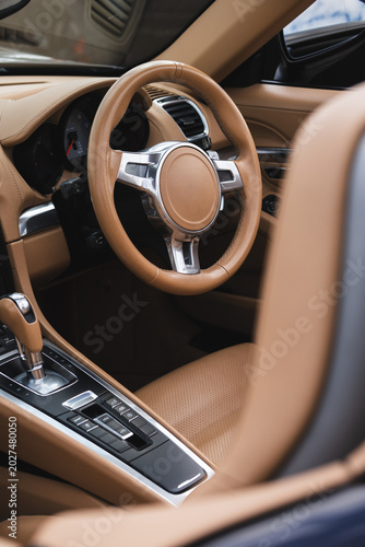 Car steering wheel car interior and dashboard, leather seats luxury sports car