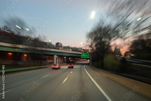 Point of view driving car on asphalt highway under overpass
