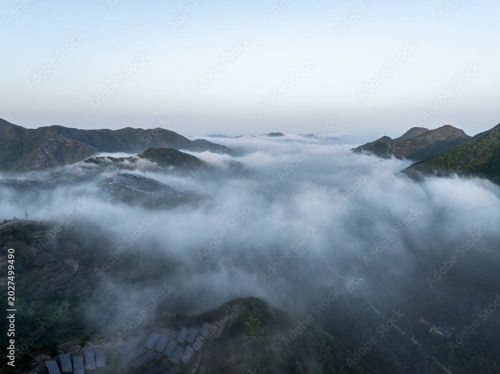 Fototapeta premium Magnificent sunrise view over mountains with sea of clouds and misty landscape