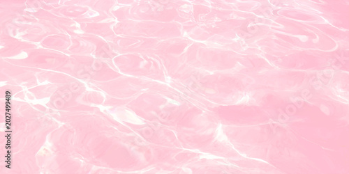Photos Pink water ripples background, abstract liquid surface texture with soft light c