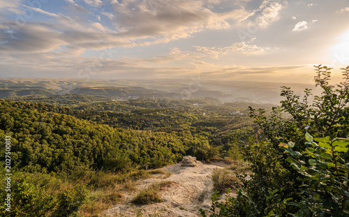 View of the mountains and Kislovodsk from the observation decks of the Kislovodsk Park. Evening sunset over the mountains of Kislovodsk.
