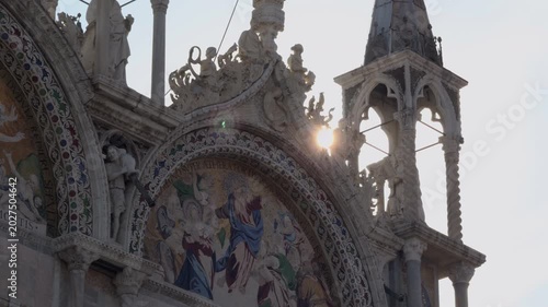 Sunrise Glow on Ornate Cathedral Facade in Venice