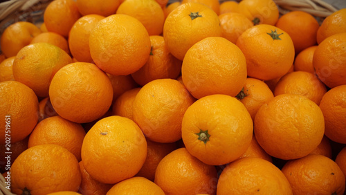 Fresh Oranges in Wicker Basket Close Up