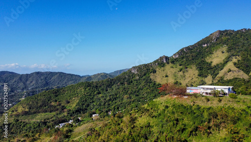 Aerial Puerto Rico Tropical Mountain Building Flag Ponce Area Drone