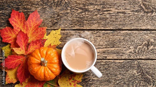 Autumn Flat Lay With Leaves Pumpkins and Warm Drinks on Wooden Surface