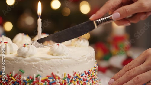 Slow Motion Cake Cutting for a Birthday Celebration in Soft Light