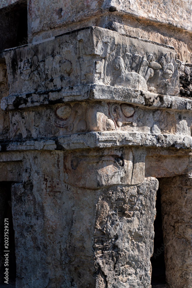 Fototapeta premium Ancient Mayan Stone Relief and Stucco Carving Details at Tulum Ruins Mexico