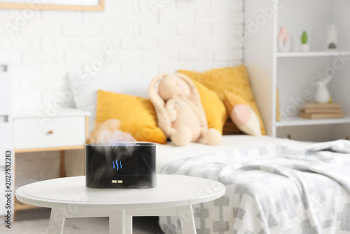 Air humidifier on table in ...