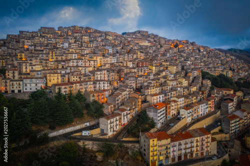 Sunset view of the rooftops of Gangi . Sicily, Italy. August 2024. Aerial drone picture.