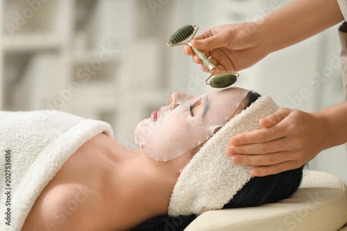 Cosmetologist with massage ...