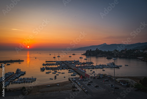 Panoramic sunrise view of sea port of Cefalu, Metropolitan City of Palermo, coastal town in northern Sicily, Italy. August 2024.