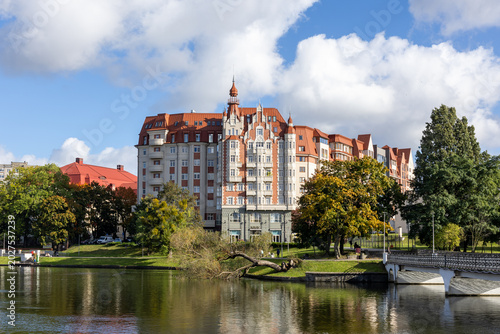 Bild auf Leinwand View of historic house by the lake in daytime with cloudy sky in Kaliningrad