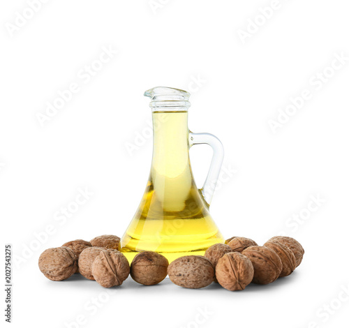 Tasty walnuts and jug of oi...