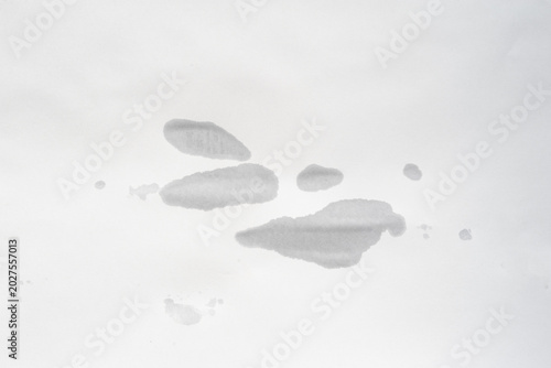 Wet stains from splashes on old paper. Blank sheet