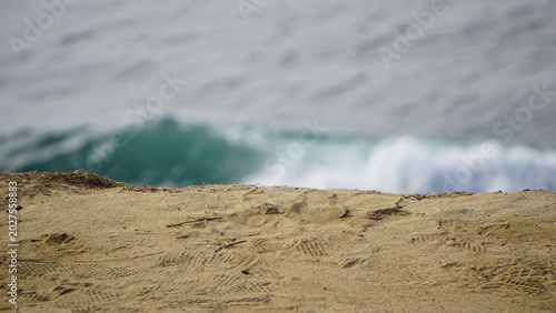 Bilde på lerret Ocean wave approaching sandy shoreline