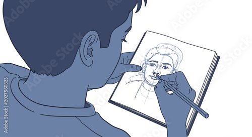 Boy drawing on a sketchbook.