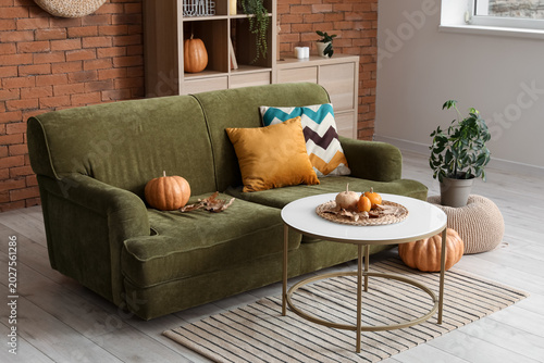Comfortable sofa with pumpk...