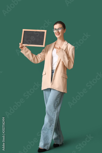 Female teacher pointing at ...