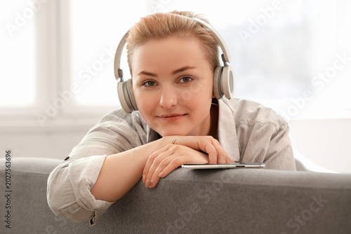 Young woman in headphones w...