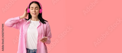 Young woman in headphones a...