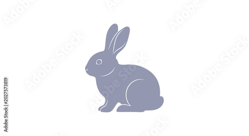 Vászonkép Gray rabbit sitting on ground.