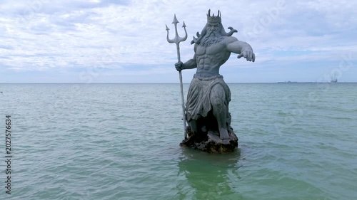 Greek God Poseidon Statue inside the Ocean at Progreso Beach Yucatan. Mexico.