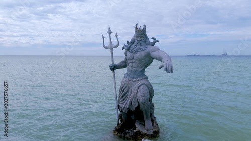 Greek God Poseidon Statue inside the Ocean at Progreso Beach Yucatan. Mexico.