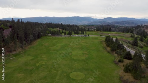 Rising Crane drone aerial on golf course driving range Kelowna