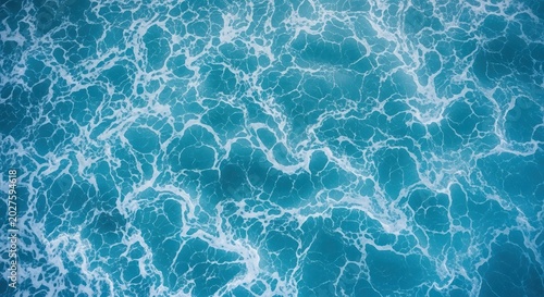 Intricate Web of White Sea Foam Across a Vibrant Turquoise Ocean