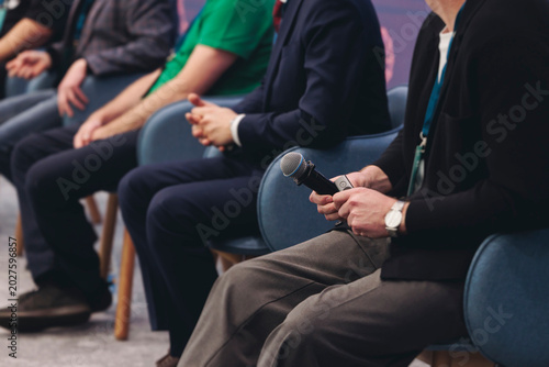 Photos Panel discussion at conference, group of speakers debate at the business confere