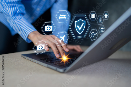 Businessman using laptop for online insurance policy planning and health protection