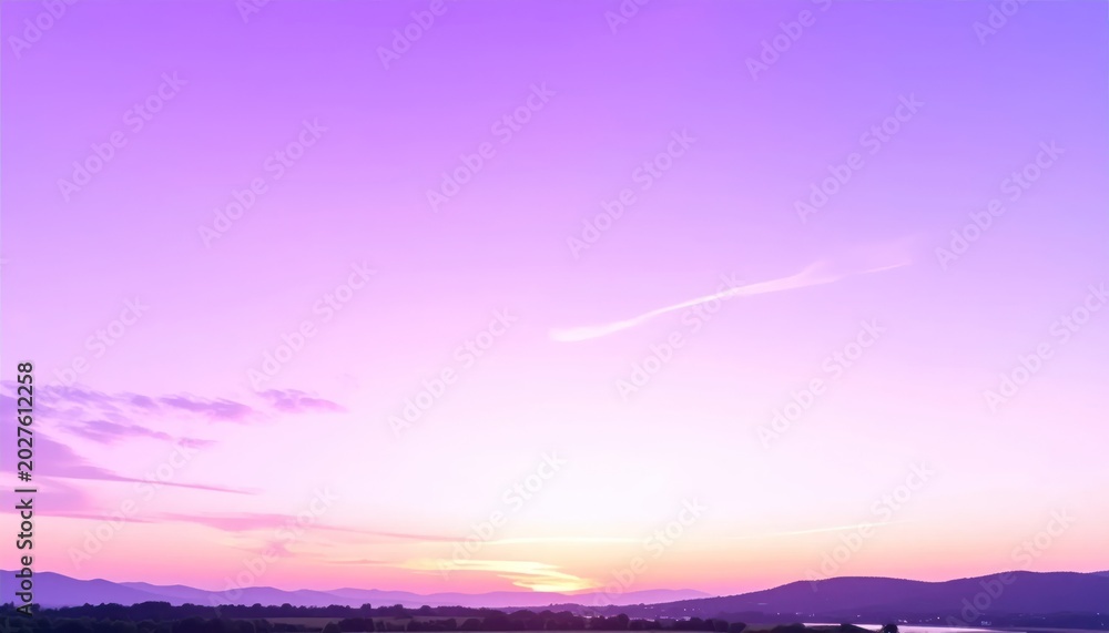 Obraz premium Vibrant Purple Sunset Over Rolling Hills and Distant Water.