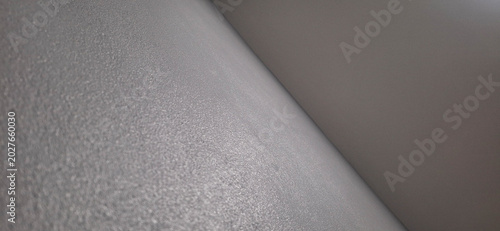 Smooth grey wall texture with soft diagonal curve background