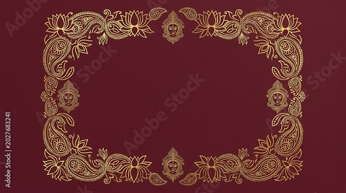 Ornate golden paisley and lotus flower frame on a deep maroon background, for traditional indian border