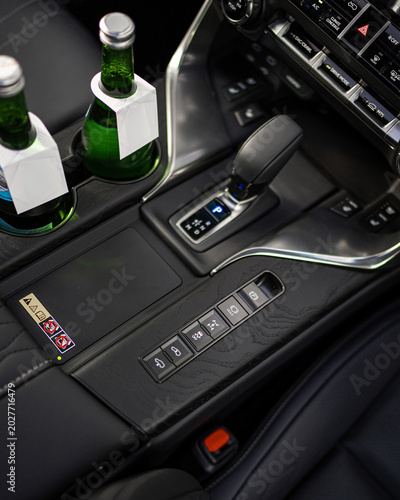 Luxurious Car Interior With Modern Center Console And Gear Shifter.