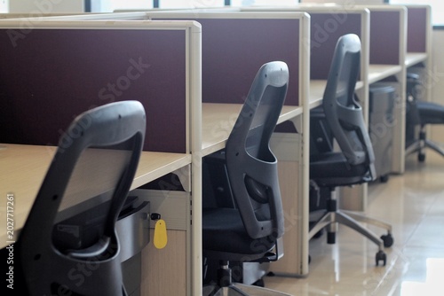 Empty Office Cubicles With Ergonomic Chairs In Modern Corporate Workspace With Clean Minimal Design