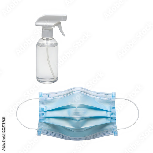 Disinfectant spray bottle with blue protective face mask for hygiene purposes transparent background