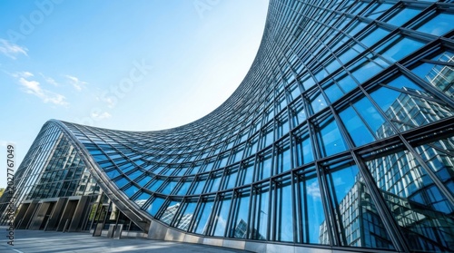 Modern Curved Glass Office Building Facade Architecture Reflecting Blue Sky