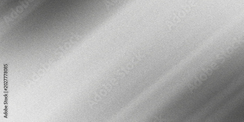 Abstract monochromatic grainy background featuring diagonal light streaks across a textured gray surface with subtle variations.