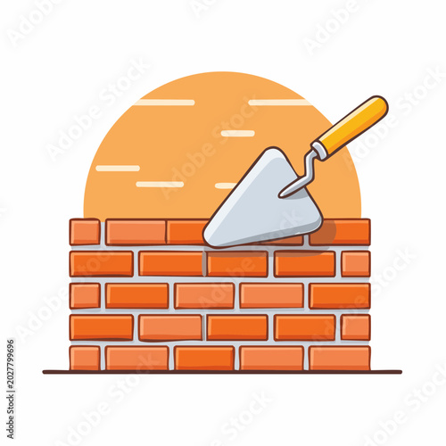 Bricklaying Trowel on New Brick Wall Construction