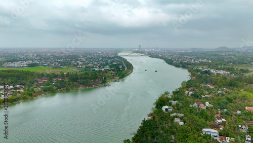 Obraz na plátně Hue City, Central Vietnam – 4K Aerial Drone View of Perfume River, Urban Skyline