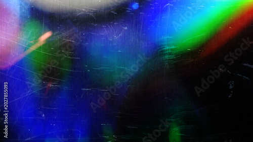 film colorful light leaks,grunge film background,retro film overlay effect with scratch dust and ray, retro grain noisy film distressed texture light leak flare on black background